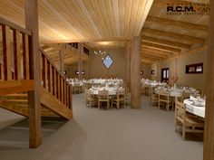 the inside of a restaurant with wooden tables and white tablecloths on it's tables