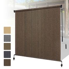 a brown roller shade with four different colors on the side and one is closed to let light in