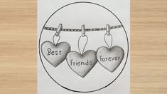 two hearts hanging on a clothes line with the words best friends forever written below them