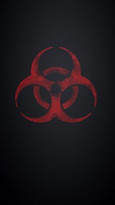 a red and black biohazard symbol on a black background with the words,