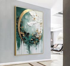 an abstract painting hangs on the wall next to a couch and chair in a living room