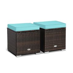 two brown wicker boxes with blue cushions