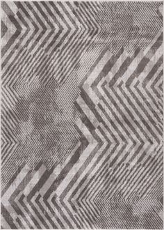 a gray and white rug with an abstract design