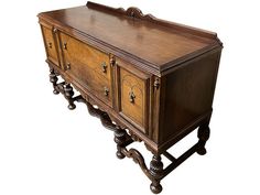 an old fashioned wooden cabinet with drawers on it's sides and legs, against a white background