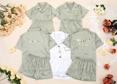 three children's shirts and onesuits with flowers in the background