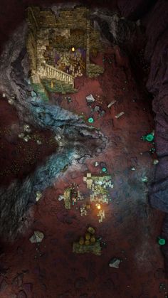 an aerial view of a building in the middle of some rocks and dirt with green lights on it