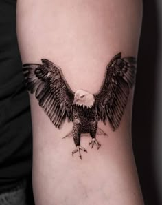 an eagle tattoo on the arm