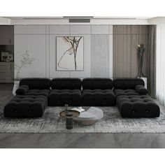 a modern living room with black leather furniture