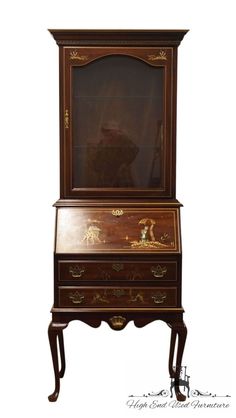 an old fashioned desk with a mirror on top