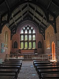 the inside of an old church with pews