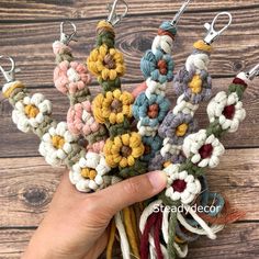 someone is holding some crocheted flowers in their hand with the words diy knit written on it