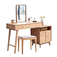 a wooden desk with a mirror and stool