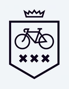 a black and white image of a bicycle on a shield