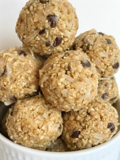 a white bowl filled with oatmeal chocolate chip energy bites