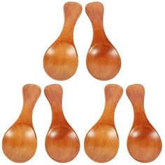 six wooden spoons are lined up in a row