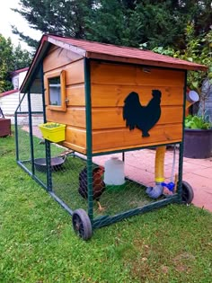 a small chicken coop with chickens in it's back legs and feet on the ground