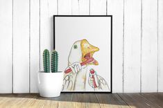 a duck with a toothbrush in its mouth next to a cactus