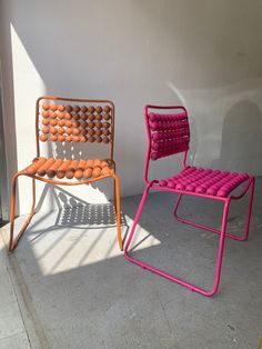 two colorful chairs sitting next to each other