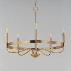 a chandelier with five lights hanging from it's center and four arms