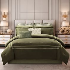 a bed with green comforter and pillows in a room next to two nightstands