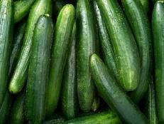 green cucumbers are piled up together