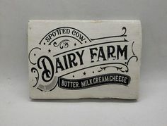 an old dairy box with the word dairy farm printed on it's front and side