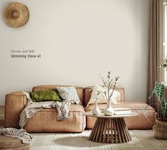 a living room with a couch, table and potted plants on the coffee table