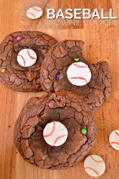 three chocolate baseball cookies on a wooden table