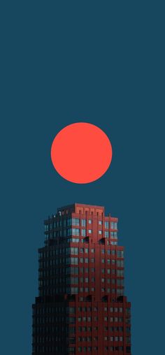 an orange object is in the sky above a tall building with windows and dark blue background