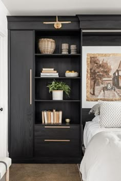 A dark wood wall unit with a pull down wall bed. There is shelving and cabinets on both the right and left sides of the bed. Murphey Bed, Murphy Bed Office, Bed Closet, Guest Bedroom Office, Guest Bedroom Home Office, Room At Night, Bed Unit, Home Office/guest Room, Modern Murphy Beds