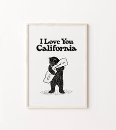 a black bear holding a sign that says i love you california