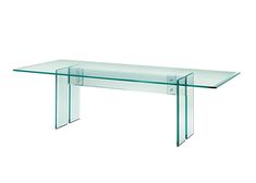 a glass table that is sitting on top of a white surface with no people around it