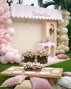 a hello kitty themed birthday party with balloons