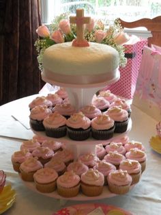 a cake and cupcakes on a table