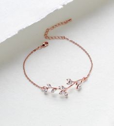 So lovely and delicate.  I created this bracelet in rose gold finish with Premium European crystals.  A romantic leaf design perfect for weddings or everyday.   Bracelet pictured measures 6 inches and extends to 8 inches. Bracelet is .5 inch wide. PLEASE ALLOW APPROX 7 BUSINESS DAYS FOR COMPLETION BEFORE SHIPPING This is an original design by © Treasures by Agnes MATCHING PIECES: https://www.etsy.com/listing/485297202/bridesmaid-necklace-rose-gold-necklace?ref=shop_home_active_2 https://www.etsy.com/listing/511298012/rose-gold-earrings-crystal-bridal Feel free to contact me with any questions !  Thank you for visiting ! Treasures570  Back to main page of Treasures570 for more beautiful designs https://www.etsy.com/shop/treasures570?ref=hdr_shop_menu All pieces come beautifully gift wrapped Elegant Rose Gold Crystal Bracelet For Anniversary, Adjustable Delicate Rose Gold Diamond Bracelet, Dainty Rose Gold Chain Bracelet For Wedding, Dainty Rose Gold Bracelets For Wedding, Delicate Rose Gold Cubic Zirconia Bracelets, Elegant Rose Gold Chain Bracelet For Wedding, Dainty Rose Gold Wedding Chain Bracelet, Minimalist Rose Gold Bracelets For Wedding, Delicate Rose Gold Bangle Chain Bracelet