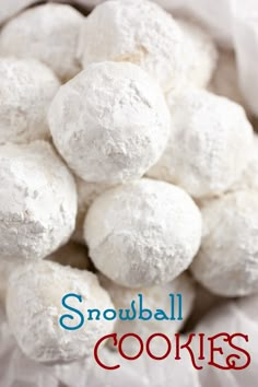 a pile of snowball cookies sitting on top of each other