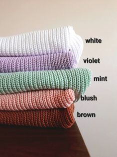 four towels stacked on top of each other with words describing the different types of them