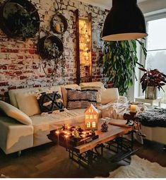 a living room filled with furniture and candles