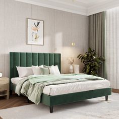 a bedroom with a green headboard and white sheets on the bed in front of a window