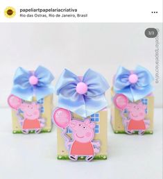 three peppa pig boxes with bows on them