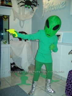 a person in an alien costume pointing at something