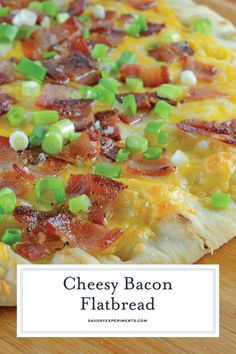 a cheesy bacon flatbread on a cutting board