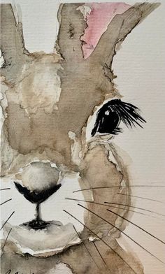 a watercolor painting of a rabbit's face