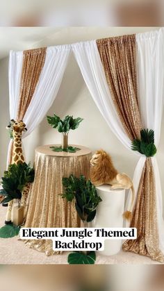 an elegant jungle themed backdrop with gold and white drapes