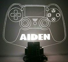 a lit up video game controller with the word aden on it's side