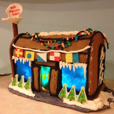 a gingerbread house decorated with icing and decorations