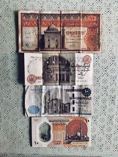 several different types of currency are hanging on the wall