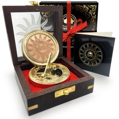 an open box with a golden clock inside