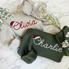 Embroidered Personalized Name Christmas Sweater  - Embroidered Items are stitched to order. Please allow 1-2 weeks for items to ship.  - Unisex Crewneck Sweatshirt - Designed with pre-shrunk soft air-jet spun yarn - Loose fit for a comfortable feel * Sizing and Colors - Please refer to sizing and color charts in the images * Fabrication - 50% cotton, 50% polyester * Care Instructions - Turn inside out and machine wash cold on delicate cycle - Dry on low heat setting - Do not bleach - Do not dry Christmas Matching Sweaters, Women’s Christmas Sweater, Machine Embroidered Sweatshirt, Embroidered Christmas Holiday Tops, Embroidered Cotton Christmas Sweatshirt, Christmas Cotton Sweatshirt With Embroidered Logo, Christmas Long Sleeve Sweatshirt With Embroidered Text, Embroidered Christmas Holiday Sweatshirt, Christmas Holiday Embroidered Sweatshirt