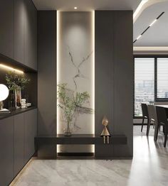 an elegant dining room with marble flooring and black walls, lighted by recessed lighting